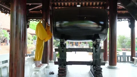 The monk is drumming during the Buddha in the old temple prayer ceremony Stock Footage 156724904