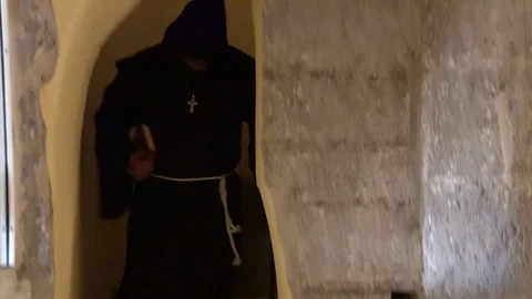Monk is his Bible before praying Stock Footage 97468433