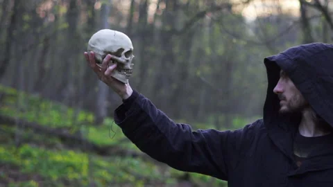 A monk in a hood with a skull 스톡 동영상 196607850