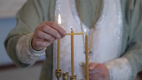 Monk lighting candle Stock Footage 97628072