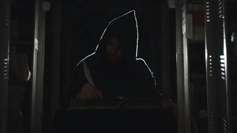 Monk is making notes with feather Stock-Footage 99100118