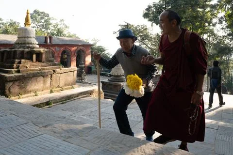 Monk with an Old Man Stockfoto's