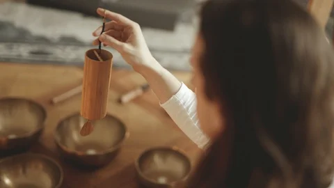 Monk playing on Koshi Wind Chimes Sound Therapy 4K Stock Footage Stock Footage 92562415
