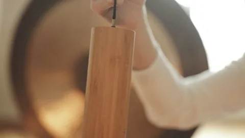 Monk playing on Koshi Wind Chimes Sound Therapy 4K Stock Footage Stock Footage 92562627