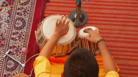 Monk plays on tabla drums. Slow motion. Stock Footage 119050480