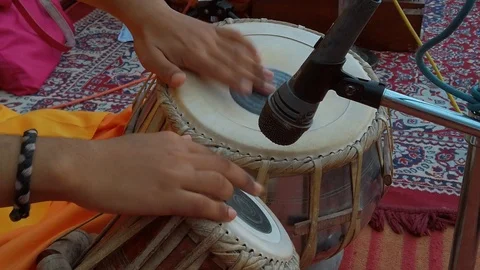 Monk plays on tabla drums. Slow motion. Stock Footage 119057014
