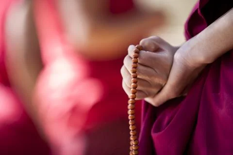 Monk with prayer beads Stock-Fotos