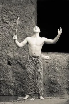 Monk praying in a monastery Stock Photos