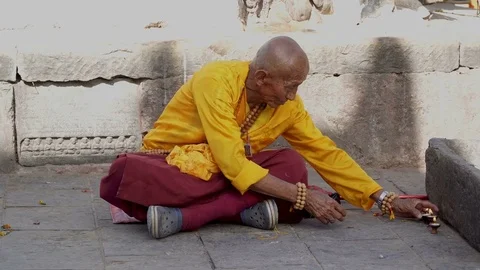 The Monk Prepares for Prayer Stock Footage 83244678