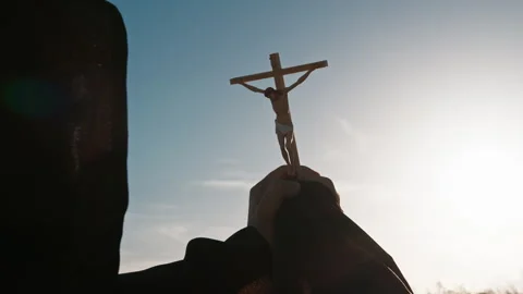 Monk raises crucifix to the sky Stock Footage 272500316
