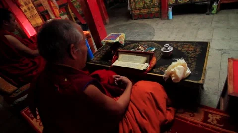 Monk reading a prayer book inside the monastery, Mustang, Nepal Stock Footage 62924006