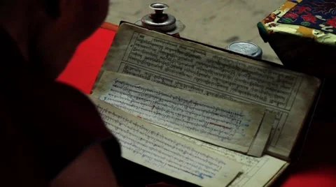 Monk reading a prayer book inside the monastery, Mustang, Nepal Stock Footage 62924018