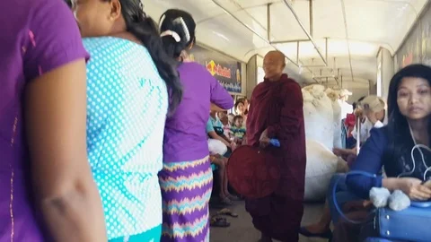 Monk stands inside shaky crowded train wagon, Burmese locals, Yangon, Myanmar 스톡 동영상 78289955