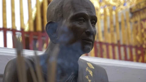 Monk Statue Behind Incense Smoke Thailand Video stock 120545951