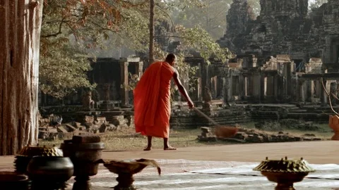 Monk Sweeping the Ground Near Angkor Wat Stock Footage 74193076