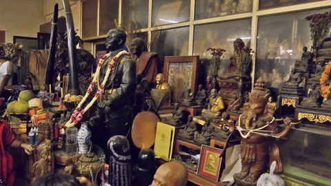 A monk tattoos the forehead of a female devotee, Thailand Stock Footage 123522072