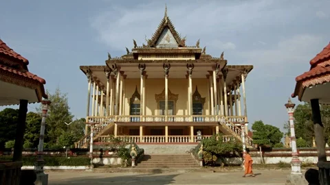 Monk Walking by the 100-Columns-Pagoda in Kratie / Cambodia Video stock 74193434