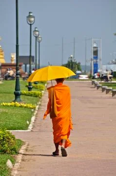 Monk walking down path Stock Photos