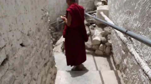 Monk Walking Down Stairs at Buddhist Monastery Video stock 47598956