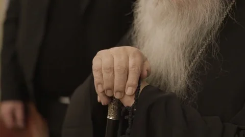 Monk with walking stick in hands Stock Footage 71589989