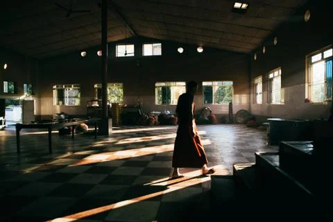 Monk walking through a kitchen Stock Photos