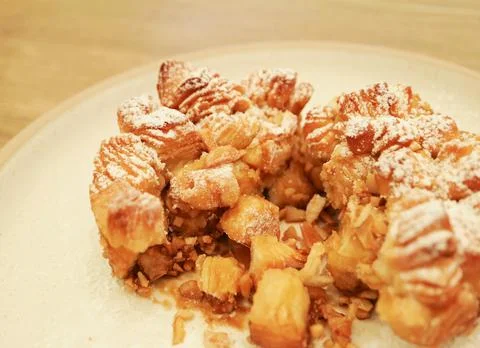 Monkey bread showing soft buttery texture and chopped almonds inside Stockfoto's