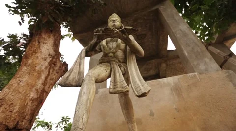Monkey God  also known as Lord Hanuman statue in front of temple in India Stock Footage 55635573