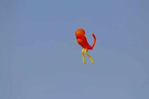 A monkey shape balloon flying in the sky Stock Photos
