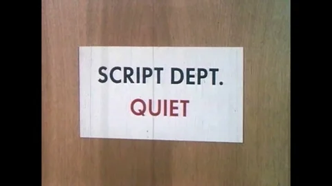 A monkey writes a screenplay on a typewriter and the title page is shown in a Stock Footage 88873253