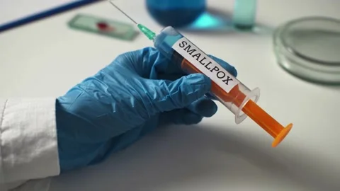Monkeypox medicine syringe for protection. Notepad, tablet symptoms of monke Stock Footage 202633428