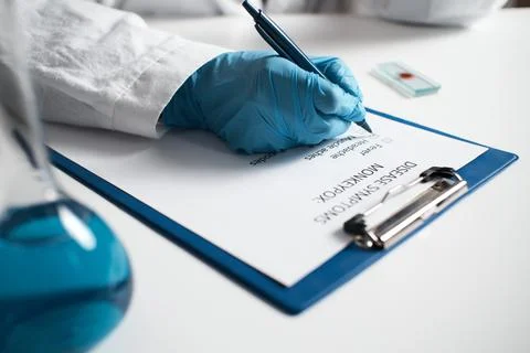 Monkeypox symptoms of virus. Doctor notes each of symptoms of monkeypox viru Stock Photos