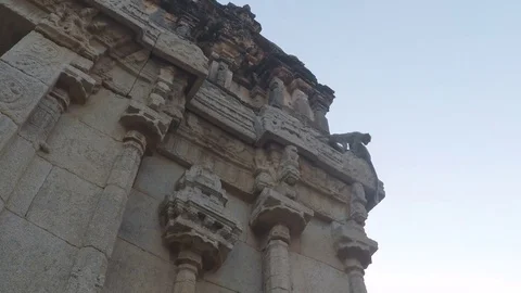 Monkeys crawl on gate of ancient temple in Hampi, India. Stock Footage 83469382