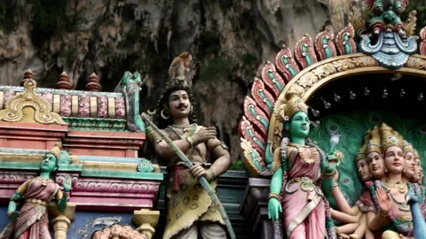 Monkeys jumping on statues at Hindu temple Stock Footage 139811076
