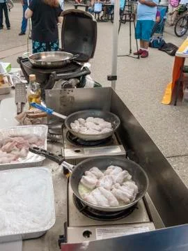 Monkfish chunks cooking Stock Photos