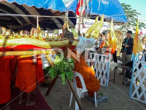 Monks and Thai people perform religious rituals. Stock Photos