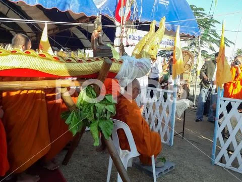 Monks and Thai people perform religious rituals. Stock Photos