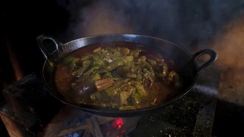 Monks are cooking something on the fire Stock Footage 78885205