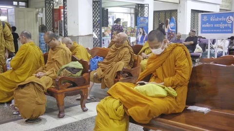 Monks are sitting at the train station in Bangkok Stock Footage 79145569