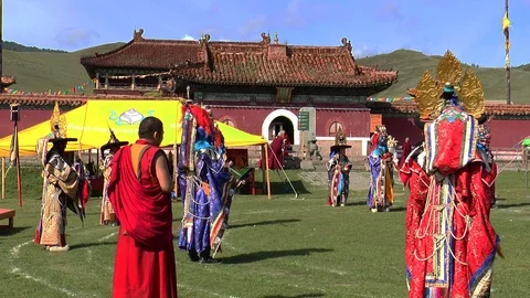 Monks of a Buddhist monastery in Mongolia perform a sacred religious dance. Video stock 121889130