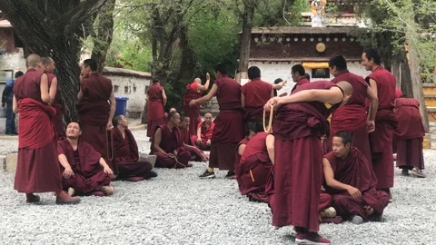 Monks in the debating courtyard at Sera Monastery in Lhasa, Tibet 스톡 동영상 112582481
