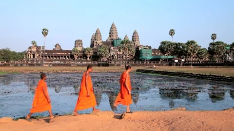 Monks walking outside the temple of Angkor Wat, Angkor, Siem Reap, Cambodia Stock Footage 8526824