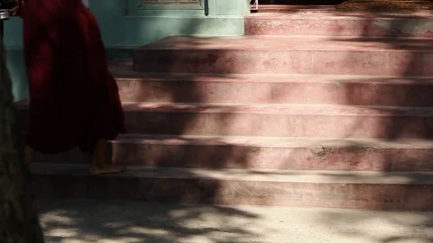 Monks walking up stairs Stock Footage