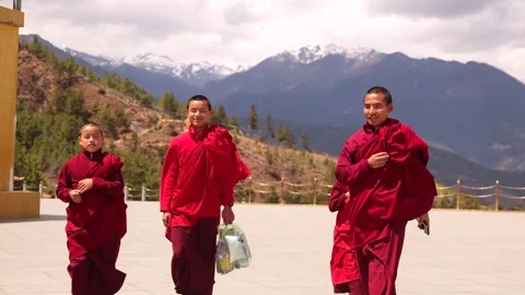 Monks Walking Through Himalayan Mountain Temple Courtyard in Bhutan, Asia Stock Footage 344055329