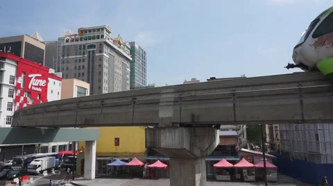 Mono rail train passing by the Kuala Lumpur city Stock Footage 66419840