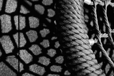 Monochromatic abstract image of shadows of a net 스톡 사진