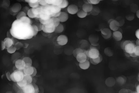 Monochromatic dreamlike composition featuring blurred light, inviting a sen.. Stock Photos