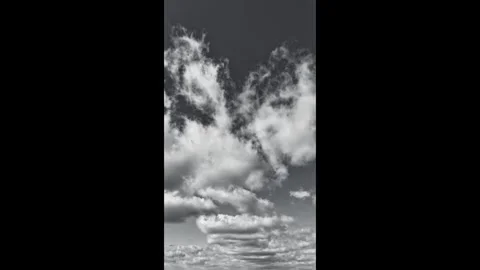Monochrome cinematic drone hyperlapse of a large cloud cluster Stock Footage 321823717