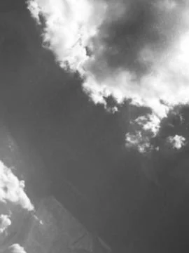 Monochrome cloudscape featuring dramatic cumulus clouds. Photos