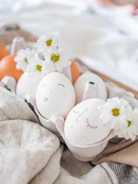 Monochrome easter eggs with faces top view. Easter holiday concept. Rustic Stock Photos