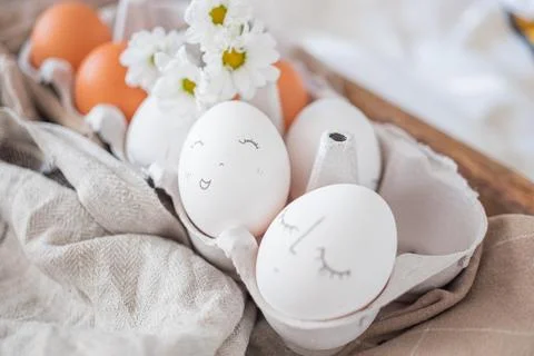 Monochrome easter eggs with faces top view. Easter holiday concept. Rustic Stock Photos